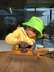 Kindergarten children working on their woodworking projects