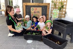 Juliet Davis, sustainability winner for G8 Standout Educator awards 2022, with children at her centre